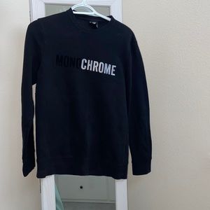Minimalistic H&M black sweatshirt with a “MONOCHROME” sign. XS size